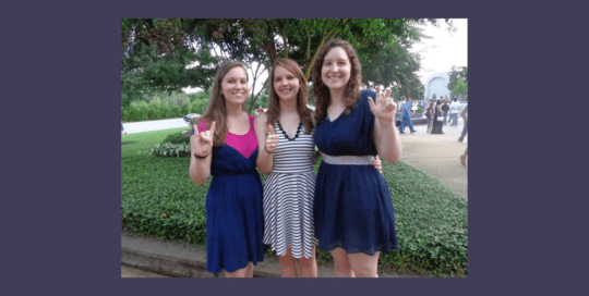 Three beautiful girls posing for a photo in a park_