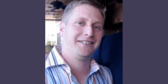 Selfie of a man in a lining shirt and smiling_EricWormser